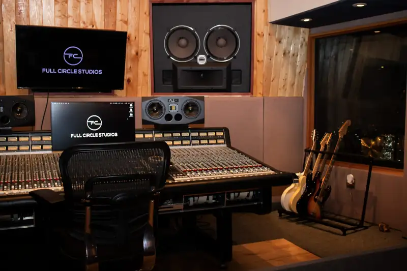 Studio A control room with an SSL 4040E console and soffit-mounted monitors