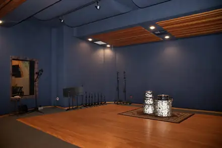 Studio A live room with hardwood floor and drum kit